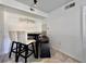 Cozy dining area with tile flooring, a dark wood table, and a mix of chairs and bench seating at 3016 Parkway Blvd # 110, Kissimmee, FL 34747