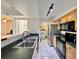 Functional kitchen featuring stainless steel appliances, ample cabinet space, and green countertops at 3016 Parkway Blvd # 110, Kissimmee, FL 34747