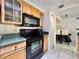 Kitchen featuring stainless steel appliances, ample cabinet space, and open access to the dining area at 3016 Parkway Blvd # 110, Kissimmee, FL 34747