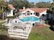 Community pool with ample seating, a jacuzzi and a clubhouse for residents' enjoyment at 3016 Parkway Blvd # 110, Kissimmee, FL 34747