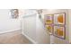 Hallway area featuring artwork and carpeted floors at 312 Preston Cove Dr, St Cloud, FL 34771