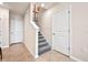 Upstairs hallway features two white doors and artwork on the wall near the stairs at 312 Preston Cove Dr, St Cloud, FL 34771