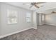 Spacious bedroom featuring two windows for natural light and neutral wall color at 34429 Alameda Dr, Sorrento, FL 32776