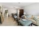 Bright and airy living room with stylish furnishings and tile flooring throughout at 34429 Alameda Dr, Sorrento, FL 32776