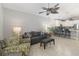 Open-concept living room connects the kitchen and dining area, creating a cohesive and welcoming living space at 34429 Alameda Dr, Sorrento, FL 32776