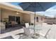 Patio with outdoor dining set and a partial view of the home at 34429 Alameda Dr, Sorrento, FL 32776