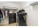 Walk-in closet with shelving, hanging racks, and a treadmill at 34429 Alameda Dr, Sorrento, FL 32776