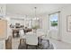 Bright dining area adjacent to the kitchen, featuring modern decor and ample natural light at 3495 Salvia Ct, Tavares, FL 32778