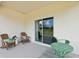 Enjoy outdoor relaxing on this covered patio with a view at 3495 Salvia Ct, Tavares, FL 32778