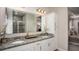 Bright bathroom with double vanity, granite countertop, and built-in storage at 421 W Ariel Rd, Edgewater, FL 32141