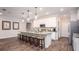 Stylish kitchen featuring a granite island, stainless appliances, and seating for Gathering and friends at 421 W Ariel Rd, Edgewater, FL 32141
