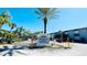 Millennium Palms gated community entrance featuring lush landscaping and well-manicured grounds at 4759 S Texas Ave # 4759C, Orlando, FL 32839