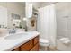 Bright bathroom featuring a vanity with a white countertop and shower at 569 Vista Sol Dr, Davenport, FL 33837