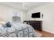 Comfortable bedroom featuring a queen-sized bed, a ceiling fan, a dresser, and a window at 569 Vista Sol Dr, Davenport, FL 33837