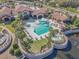 Aerial view of the community pool featuring a hot tub, large pool deck with lounge chairs and a clubhouse at 569 Vista Sol Dr, Davenport, FL 33837