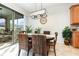 Formal dining room featuring a wooden table with seating for four at 569 Vista Sol Dr, Davenport, FL 33837