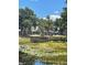 Wooden dock by a lake with trees in the background showcasing community access to waterfront features at 569 Vista Sol Dr, Davenport, FL 33837