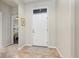 Bright entryway featuring a neutral color scheme and tile flooring at 569 Vista Sol Dr, Davenport, FL 33837