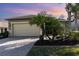 Charming single-story home with a large two-car garage and a beautifully paved driveway at 569 Vista Sol Dr, Davenport, FL 33837