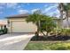 Charming single-story home with a large two-car garage and a beautifully paved driveway at 569 Vista Sol Dr, Davenport, FL 33837