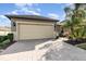 Well-maintained home featuring a spacious two-car garage and professional landscaping at 569 Vista Sol Dr, Davenport, FL 33837