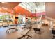 A bright and airy gym with a variety of weight machines and cardio equipment at 569 Vista Sol Dr, Davenport, FL 33837