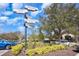 Community directional sign points to Orlando, Tampa, Kennedy Space Center, and Universal Studios at 569 Vista Sol Dr, Davenport, FL 33837