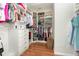Organized walk-in closet with ample storage space for clothes, shoes, and accessories at 569 Vista Sol Dr, Davenport, FL 33837