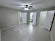 Spacious bedroom showcasing bathroom and closet entries and tiled flooring at 629 Dory Ln # 202, Altamonte Springs, FL 32714