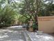 The community entrance with mature trees and landscaping provides ample parking for residents and visitors at 629 Dory Ln # 202, Altamonte Springs, FL 32714