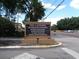 Community sign for The Landing is centrally located at the community entrance on a well-maintained street at 629 Dory Ln # 202, Altamonte Springs, FL 32714