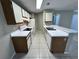 Bright kitchen with matching appliances, tile floors, and an eat in bar at 629 Dory Ln # 202, Altamonte Springs, FL 32714