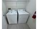 Laundry room featuring a washing machine, dryer, and shelving at 629 Dory Ln # 202, Altamonte Springs, FL 32714