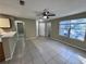 Living room showing the open floor plan, tile flooring, and natural light at 629 Dory Ln # 202, Altamonte Springs, FL 32714