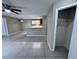 Living room with an open layout, tile floors, and view of the kitchen area at 629 Dory Ln # 202, Altamonte Springs, FL 32714