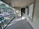 A screened in porch with a view looking out towards the parking area at 629 Dory Ln # 202, Altamonte Springs, FL 32714