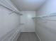 Walk-in closet with tiled floor and wire shelving system for maximum storage at 629 Dory Ln # 202, Altamonte Springs, FL 32714