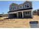 New construction home with gray siding and a two-car garage in a developing community at 726 Pointe Emerson Blvd, Apopka, FL 32703