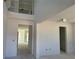 Bright, two-story foyer with views into other rooms of the home at 726 Pointe Emerson Blvd, Apopka, FL 32703