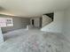 Large living room with staircase is ready to customize in new home at 726 Pointe Emerson Blvd, Apopka, FL 32703