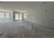 Bright, spacious living room with unfinished floors featuring a sliding glass door and large windows at 726 Pointe Emerson Blvd, Apopka, FL 32703