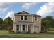 Charming two-story home with covered entry and neutral color palette; great curb appeal at 9158 Seascape Cv, Kissimmee, FL 34747