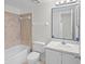 A clean bathroom featuring a shower, sink, vanity and patterned tile flooring at 940 Douglas Ave # 132, Altamonte Springs, FL 32714