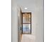 The open, secured front door reveals a bright, tiled entryway, inviting you into the home at 940 Douglas Ave # 132, Altamonte Springs, FL 32714