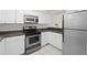 Efficient kitchen with stainless steel appliances, white cabinets, and light countertops at 940 Douglas Ave # 132, Altamonte Springs, FL 32714