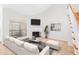 Bright living room with fireplace, wooden floors, and staircase at 940 Douglas Ave # 132, Altamonte Springs, FL 32714