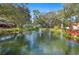 Scenic view of a pond with a fountain, surrounded by lush landscaping at 940 Douglas Ave # 132, Altamonte Springs, FL 32714