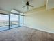 This well-lit bedroom includes carpeting and a large window showcasing neighborhood views at 101 S Eola Dr # 1009, Orlando, FL 32801