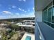 Balcony view with swimming pool and neighborhood with mature trees at 101 S Eola Dr # 1009, Orlando, FL 32801