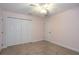 Bedroom with a large closet, neutral carpet, and ceiling fan at 10384 Se 41St Ter, Belleview, FL 34420